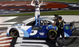 Check it out! Larson celebrates history-making win at Charlotte